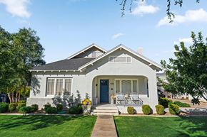 Mesa apartment for rent - A white house with a blue door and a small porch.
