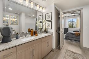 Mesa apartment for rent - a bathroom with a sink and a mirror and a door to a bedroom