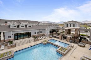 Riverton townhouse for rent - a large swimming pool with a building in the background