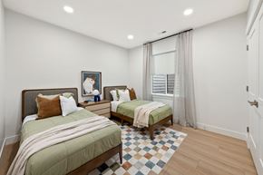 Saratoga Springs triplex for rent - A bedroom with two beds and a window.