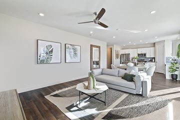 Riverton townhouse for rent - A modern living room with a white sofa and a coffee table.