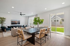 Saratoga Springs triplex for rent - A modern dining room with a large table and chairs.