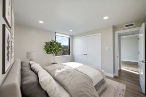 Salt Lake City apartment for rent - A bedroom with a large bed and a couch.