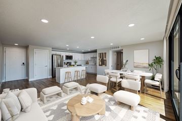 Salt Lake City apartment for rent - A modern living room with a white sofa set and a wooden coffee table.