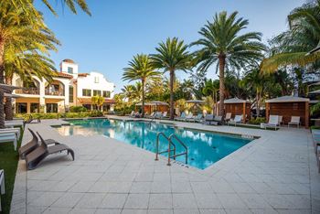Resort-style pool with cabanas