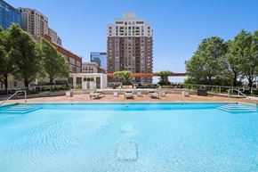 Chicago apartment for rent - Luxury outdoor pool with lounge seating and skyline views at South Loop Chicago apartments