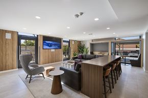 Salt Lake City apartment for rent - a kitchen and living room with a bar and a television