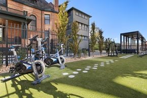 Salt Lake City apartment for rent - a group of exercise bikes parked outside of a building