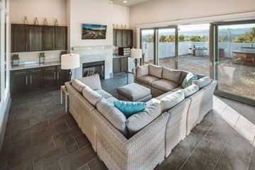 Birmingham apartment for rent - A living room with a large couch and a fireplace.