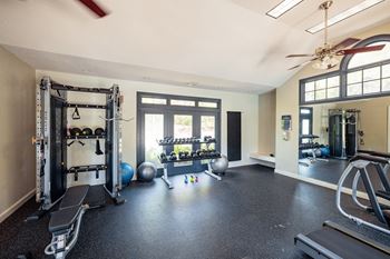 Fitness room with weights and cardio equipment