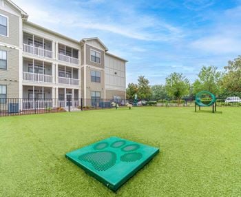 A green yard with a yoga mat