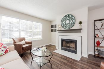 A living room with a fireplace and a couch.