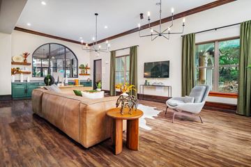 San Antonio apartment for rent - A living room with a brown sofa and a wooden table.