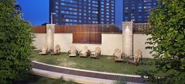 Silver Spring apartment for rent - a group of wooden chairs in a courtyard with grass