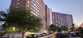 Silver Spring apartment for rent - a tall building with cars parked in front of it