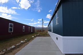 Leadville apartment for rent - a view of the side of a house with a sidewalk in front of it