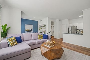 Littleton apartment for rent - A living room with a grey couch and a wooden coffee table.