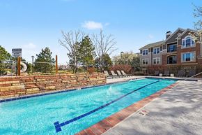 Littleton apartment for rent - A swimming pool with a warning sign in front of a house.