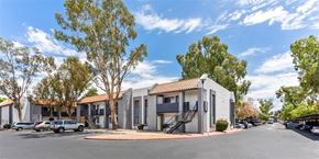 Glendale apartment for rent - A modern building with a parking lot in front.