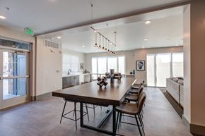 Colorado Springs apartment for rent - A large dining room with a long table and chairs.