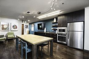 Seattle apartment for rent - A modern kitchen with a dining table and chairs.