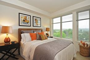 Seattle apartment for rent - A bedroom with a large bed and two lamps.