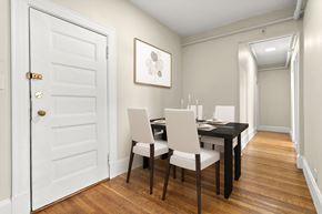 Cambridge apartment for rent - a dining room with a table and chairs and a white door