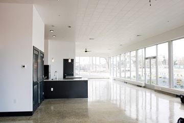 Richmond apartment for rent - A kitchen with black cabinets and a large island with a sink.