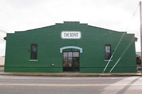 Norfolk apartment for rent - A green building with a sign that says The Depot.