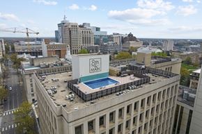 Richmond apartment for rent - A large building with a swimming pool on the roof.