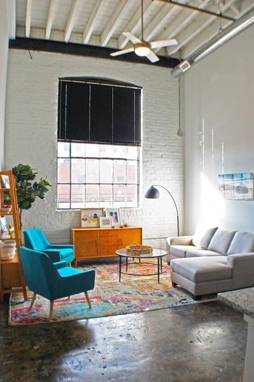 Norfolk apartment for rent - A living room with a blue chair and a white couch.