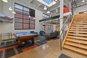 Richmond apartment for rent - A room with a pool table and a staircase.