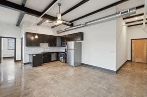 Richmond apartment for rent - A kitchen with a refrigerator, stove, and oven.