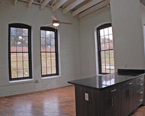 Richmond apartment for rent - A room with a large island and three windows.