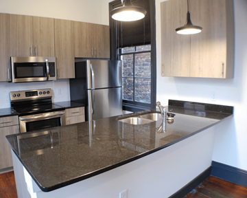 Richmond apartment for rent - A kitchen with a granite counter top and stainless steel appliances.