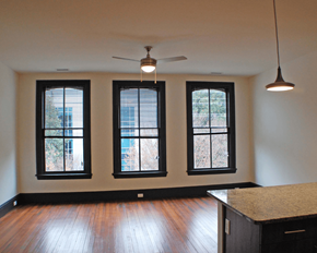 Richmond apartment for rent - A room with a ceiling fan and three windows.