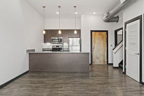 Richmond apartment for rent - A modern kitchen with a wooden island and stainless steel appliances.