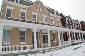 Richmond apartment for rent - A row of Victorian style houses with snow on the ground.