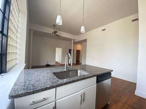 Richmond apartment for rent - A kitchen with granite countertops and stainless steel appliances.
