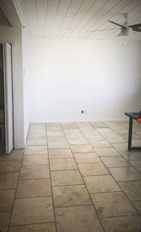 Norfolk apartment for rent - A room with a tiled floor and a ceiling fan.