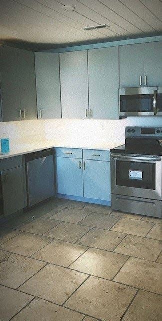 Norfolk apartment for rent - A kitchen with a stove top oven and microwave.