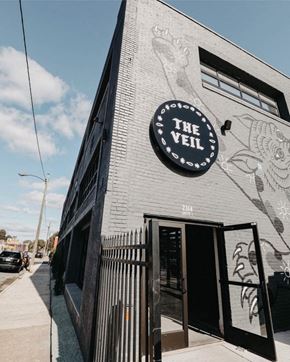 Norfolk apartment for rent - A black and white building with a sign that says "The Veil".