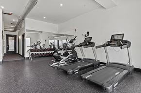 Richmond apartment for rent - A gym with treadmills and exercise equipment.