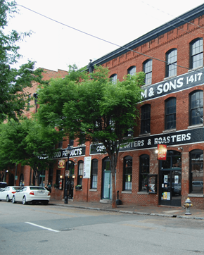 Richmond apartment for rent - A street view of a building with the sign "M&Sons 1417" on it.