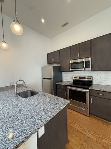 Richmond apartment for rent - A kitchen with granite countertops and stainless steel appliances.