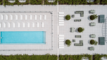 Aerial view of pool deck and outdoor lounge patio
