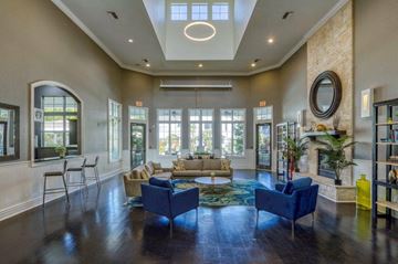 Riverview apartment for rent - a living room with couches and chairs and a large window