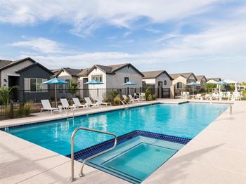 A swimming pool with a ladder in the middle of it.
