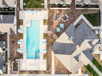 A bird's eye view of a house with a swimming pool.