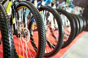 Rochelle apartment for rent - a row of bicycle wheels with tires on a red rug